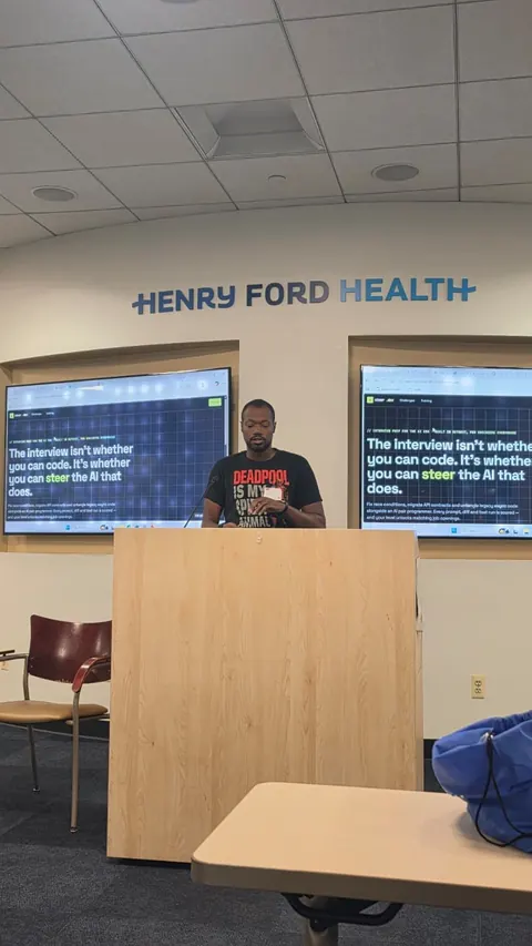 Richard H. at the podium with the Steer site on the screen behind him